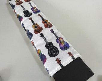 Guitar musical instrument Seatbelt cover pad with popper fastening.