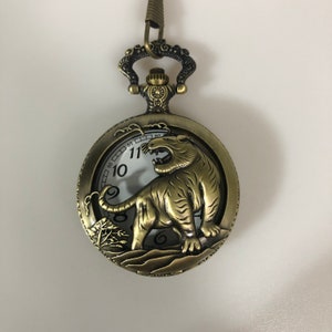 Tiger bronze pocket watch with pocket chain for men&#39;s waistcoat and Tiger design on the front showing watch face through the design