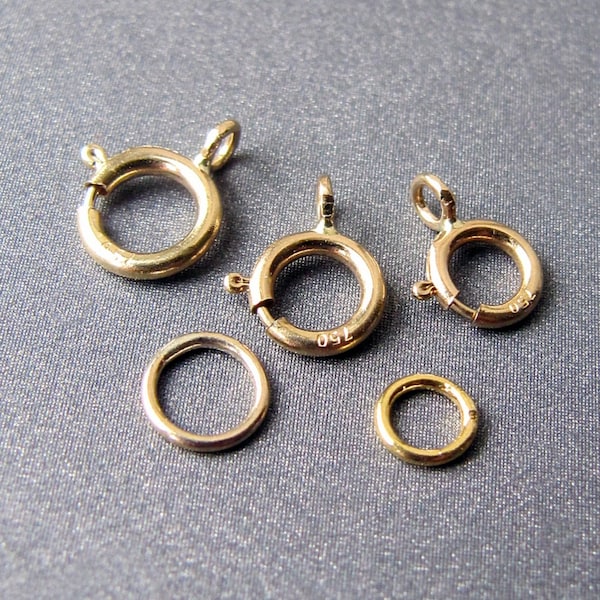 Federringverschluss aus 18 Karat Gold • 5 / 5,50 / 5,90 / 7 mm • Offene / geschlossene Öse • Massives 18 Karat Gold • Optionaler zusätzlicher Ring (separat kaufen)