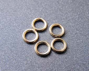 14k gouden ringetje • Open / gesloten • 2,5 mm 3 mm 4 mm 5 mm 6 mm 7,50 mm • 14-karaats massief geelgouden ring • Bedelhanger met borgtochtconnector