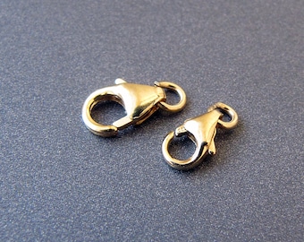 May include: Two gold-toned lobster claw clasps for jewelry making.