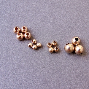 Cuenta redonda de oro rosa de 18 k • 1,8 mm 2,2 mm 3 mm 4 mm 5 mm 6 mm • Peso medio / Lo suficientemente resistente para pulseras • Oro rosa sólido de 18 quilates 750