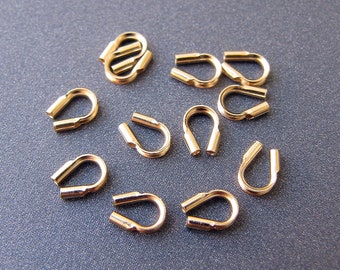 14 kt gouden draadbeschermer • Gaten van 4,50 x 4 mm / 0,5 mm • Massief 14 karaat geelgoud • Koordzijden uiteindebeschermer kraalpunt • Tarief gratis verzending naar VS