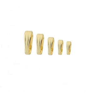 May include: Five gold-toned metal pendant bails of varying sizes. The bails are smooth and have a slightly curved shape.