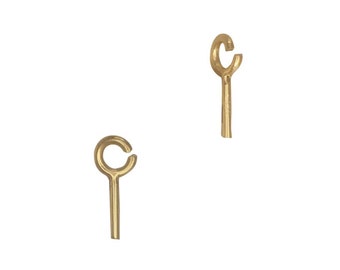 May include: Two gold-colored jump rings with a small loop at the top and a straight pin extending from the bottom.