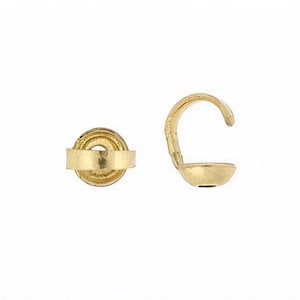 May include: Gold-toned metal crimp end caps for jewelry making. The caps have a round shape with a small hole in the center. The caps are designed to be crimped onto the end of a cord or wire to secure it.