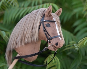 Hobby horse with an adjustable bridle+ reins