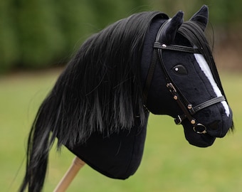 Hobby horse with an adjustable bridle and reins