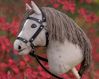 Hobby horse with a leather bridle and reins