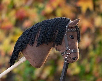 Hobby horse with a leather bridle and reins