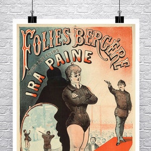 May include: A vintage poster advertising the Folies Bergere, a Parisian cabaret, featuring a woman in a black leotard and a man in a military uniform. The poster is printed in red, blue, and yellow with the text "Folies Bergere" and "Paine" in large, bold letters.
