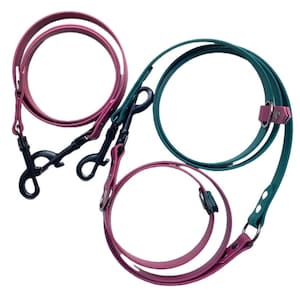 May include: Three dog leashes in pink and green with black metal clips.