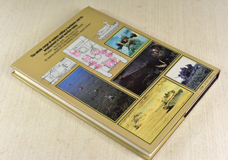 May include: The back cover of a book about modern military hardware and its use in warfare. The cover features a variety of images of military vehicles and soldiers in action. The text on the cover reads "The whole range of modern military hardware and its employment in land warfare today".