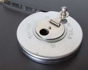 1950s ROE Steel Tape Measure/ Mid Century Wind up, Stainless Steel Tape Measure with etched numbers, 50 ft. Made in USA