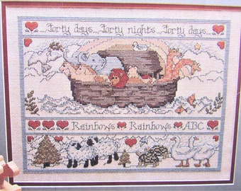 Noah's Ark Cross Stitch Sampler Pattern/ Leisure Arts.  Two by two animals with saying counted cross stitch chart