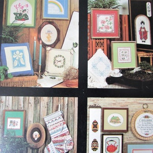 Verzamelprogramma's hoek Cross Stitch patroon boek.  Japanse Geisha, bloemen, kardinalen, Ukranian eieren geteld Cross Stitch grafiek foto