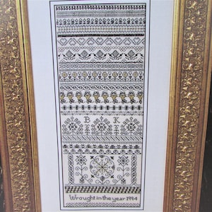 Antik svartsöm, guldfärgat korsstygnsmönster/Traditionellt bandmönster i svart och guldfärgat korsstygnsdiagram