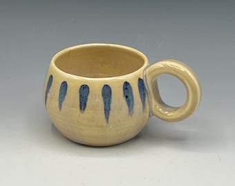 Wheel-thrown espresso mug with the hand painted designs with a opal & warm cream glaze