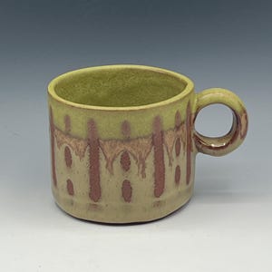 Hand-Built cappuccino mugs in a variety of wax-resist patterns in olive green and brown