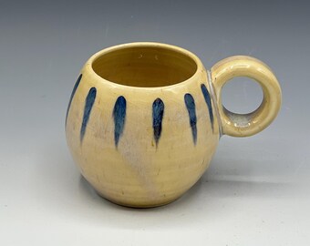 Wheel-thrown espresso mug with the hand painted designs with a opal & warm cream glaze