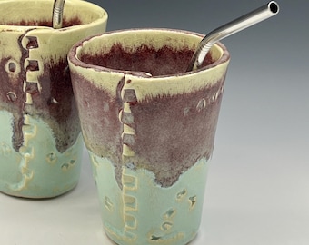 Hand-built mug with letter designs