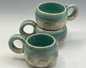 Wheel-thrown espresso mug with soft green celadon glaze
