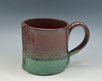 Hand-built mug with red and patina green glaze