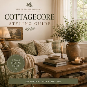 May include: A digital styling guide titled SILVER MAPLE DESIGNS COTTAGECORE STYLING GUIDE. The image features a living room with a beige sofa, patterned throw pillows, a wooden coffee table, a large ceramic vase with greenery, and candles.
