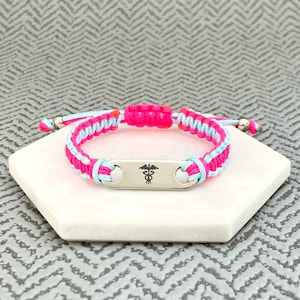 Medical alert bracelet uk with pik and sky blue nylon cord. Adjustable for any wrist, for ladies, women