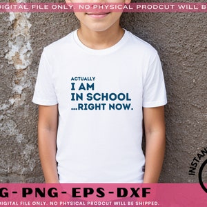 May include: White t-shirt with blue text that reads "Actually I am in school...right now."