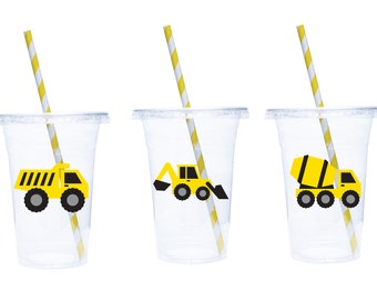 May include: Three clear plastic cups with yellow and white striped straws. Each cup has a different yellow construction vehicle sticker: a dump truck, a backhoe, and a cement mixer.
