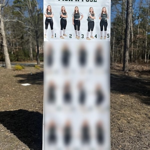 May include: A tall vertical banner with the text PICK A POSE at the top. The banner displays five clear photographs of a softball player in a dark jersey and white pants demonstrating different poses, numbered one through five, with blurred rows below.