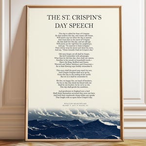 May include: A framed print featuring the text of Shakespeare's St. Crispin's Day Speech from Henry V, Act IV, Scene III. The text is in black on a cream background, with a blue and white seascape at the bottom. The frame is a light brown color.