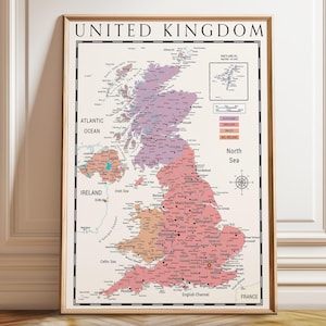 May include: Framed map print of the United Kingdom, featuring a detailed geographical layout with colored regions. The map includes labels for cities, bodies of water, and surrounding countries. The title "UNITED KINGDOM" is displayed at the top.