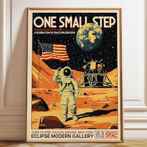 May include: A framed poster titled ONE SMALL STEP A CELEBRATION OF SPACE EXPLORATION featuring an astronaut on the moon with an American flag, a lunar module, and the Earth in the sky. Text at the bottom reads ECLIPSE MODERN GALLERY 1992.