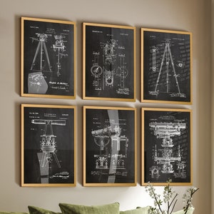 May include: Set of six black and white vintage patent drawings of surveying equipment. Each drawing is framed in a gold frame and features a different type of surveying instrument. The drawings are displayed on a wall with a green sofa and a vase of white flowers in the foreground.