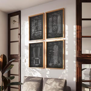 May include: Four framed wall art prints featuring white technical architectural blueprints on black backgrounds. Each rectangular print displays detailed engineering diagrams, structural schematics, and technical text, all encased in simple light wood frames.