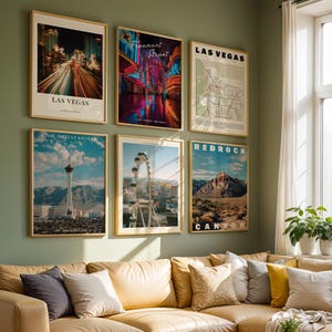 May include: A set of six framed wall art prints featuring Las Vegas landmarks including the Strat Hotel, Fremont Street, a city map, a Ferris wheel, and Red Rock Canyon, displayed in a grid arrangement above a tan leather sofa.