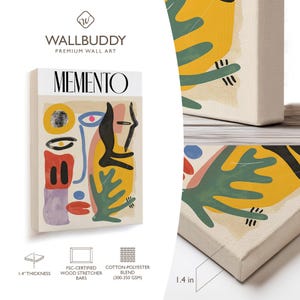 May include: A rectangular canvas wall art print titled MEMENTO featuring abstract shapes in yellow, green, red, blue, and black. The canvas has a 1.4 inch thickness, FSC-certified wood stretcher bars, and a cotton-polyester blend fabric construction.