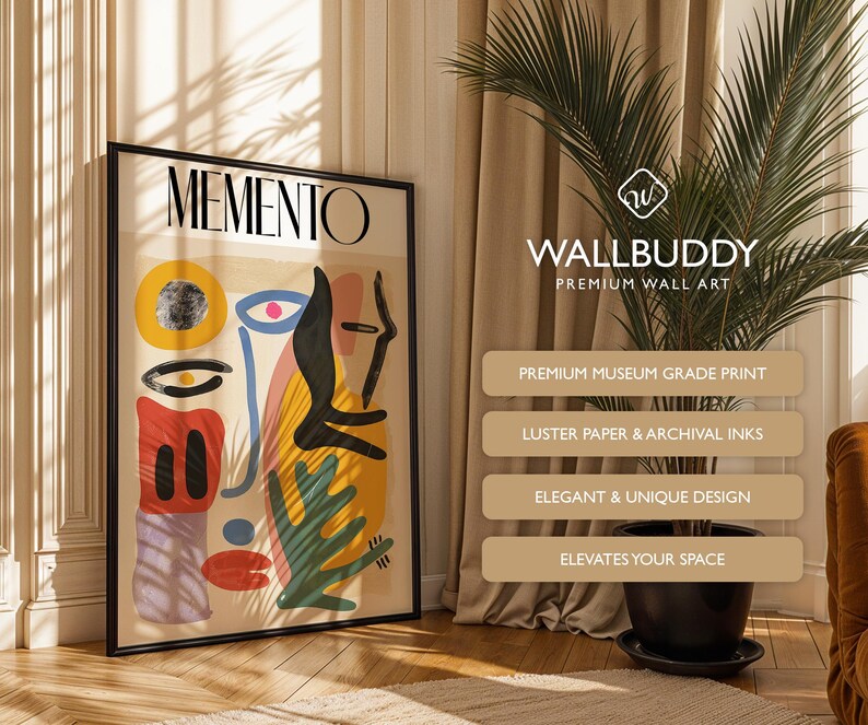 May include: A framed wall art print titled MEMENTO featuring an abstract composition of geometric shapes and organic forms in yellow, red, blue, black, and purple on a beige background, displayed in a black frame with a clean, modern aesthetic.