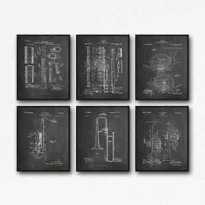 May include: Set of six vintage black and white patent drawings of musical instruments. The instruments include a clarinet, flute, french horn, saxophone, trombone, and trumpet. Each drawing features the instrument's design and technical details.