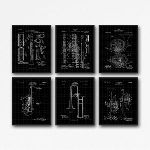 May include: Set of six black and white vintage patent drawings of different musical instruments. The instruments include a clarinet, flute, french horn, saxophone, trombone, and trumpet. Each drawing is framed with a black border and has a grid pattern in the background.