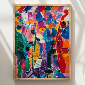 May include: A framed art print featuring a vibrant, abstract oil painting of a jazz band. The scene depicts musicians playing instruments including a double bass, drums, and brass, rendered in bold, expressive brushstrokes of red, blue, green, and yellow.
