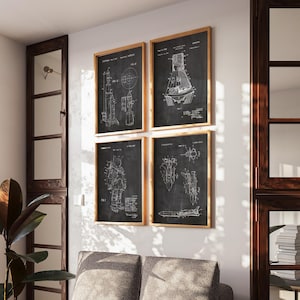 May include: A set of four framed wall art prints featuring white technical patent diagrams of space exploration equipment on a black background. Each rectangular print is encased in a light wood frame, displaying detailed schematics of rockets, a space capsule, an astronaut suit, and a space shuttle.