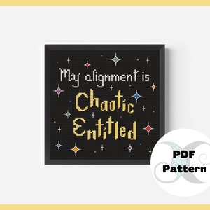 May include: A black and white cross stitch pattern with a black background and colorful stars. The text reads "My alignment is Chaotic Entitled".