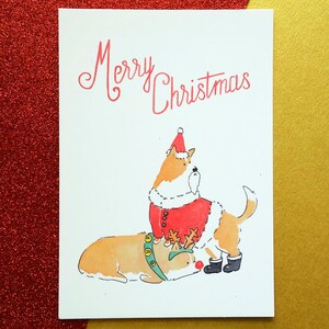 Carte postale avec corgis - Joyeux Noel - Merry Christmas - Carte de Noël avec des chiens - Corgis père-Noël et renne - lettrage manuel