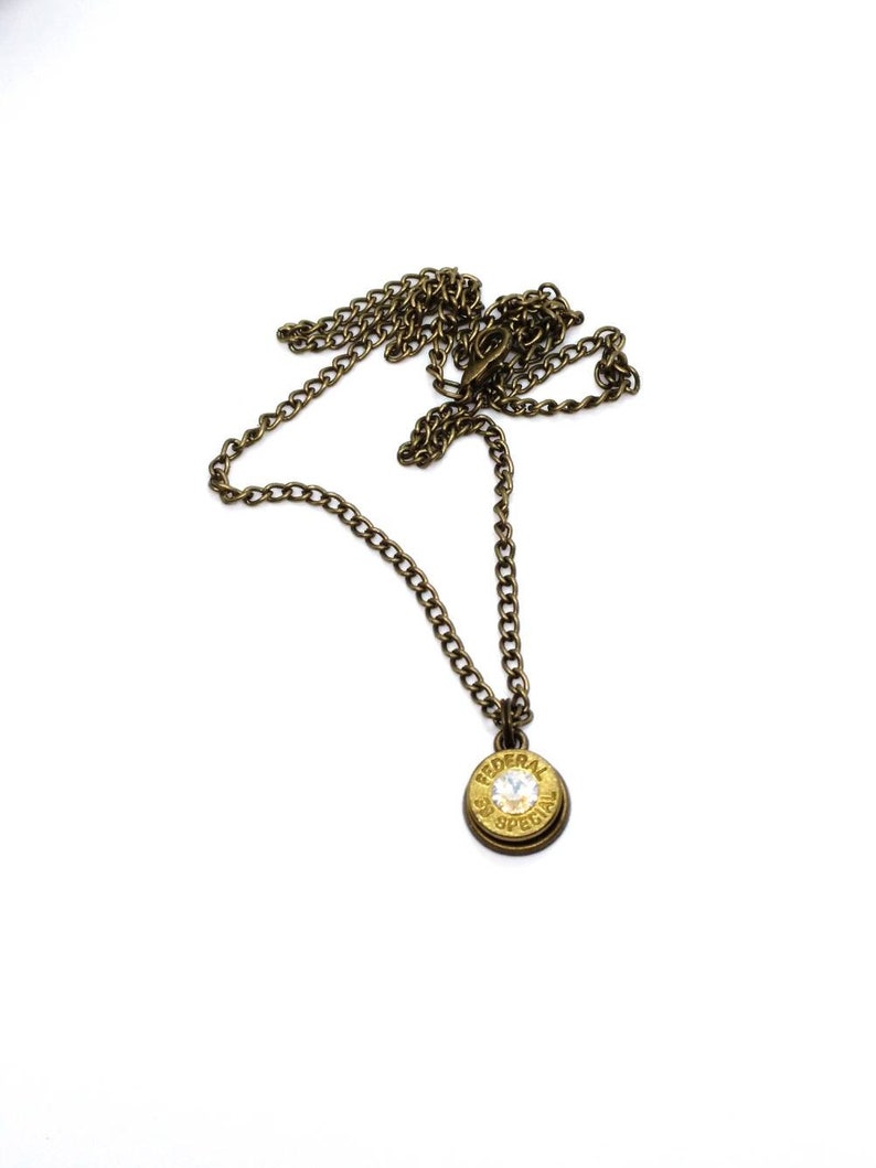 Antique brass .38 special bullet necklace and pistol earrings