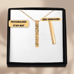 May include: A gold-toned vertical bar pendant necklace featuring a black engraved star map on the front face. A second bar pendant is shown separately, displaying side engraving with the text Your custom message here and a heart icon.