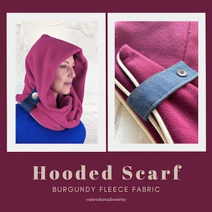 May include: Burgundy fleece hooded scarf with a denim accent and button fastening. The scarf is shown on a person and in a close-up detail. The text "Hooded Scarf" and "Burgundy Fleece Fabric" are displayed.