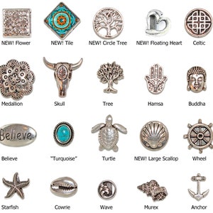 May include: A collection of silver-toned metal charms with various designs, including a flower, tile, tree, heart, Celtic knot, medallion, skull, Hamsa hand, Buddha, turtle, starfish, and anchor. Some charms have the word "NEW!"